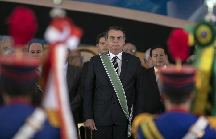 Brazilian President Jair Bolsonaro attends the swearing-in ceremony of Brazil's new Army chief, Edson Leal Pujol (out of frame), in Brasilia, on January 11, 2019. (Photo by Sergio LIMA / AFP)